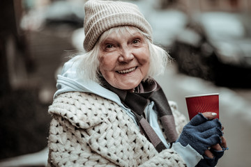 Portrait of a cheerful nice aged woman