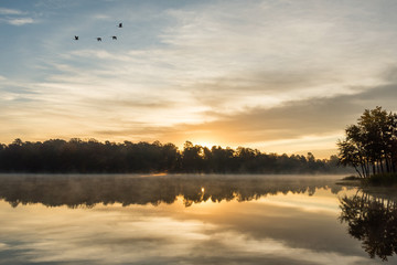 Obraz na płótnie Canvas Misty Morning Sunrise Reflections