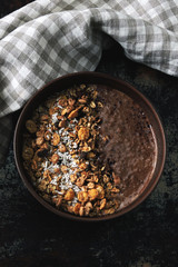 Healthy breakfast bowl with chocolate yogurt and granola.