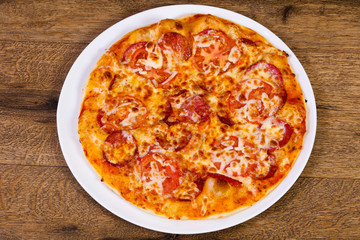 Pepperoni pizza with sausages