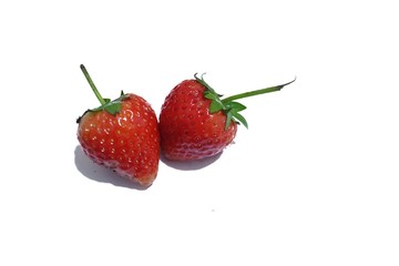 Two of fresh strawberries in white isolated background 