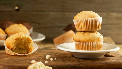Vanilla cupcake, homemade cakes on wooden background