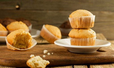 Vanilla cupcake, homemade cakes on wooden background