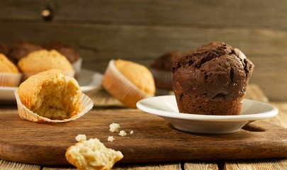 Chocolate cake and nut cake, homemade cakes on wooden background