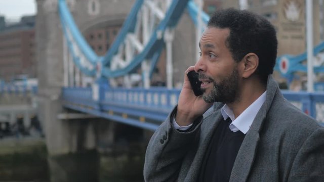 businessman on the phone at Tower Bridge London