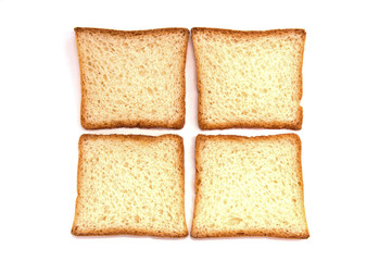 four pieces of toast bread are on a white background