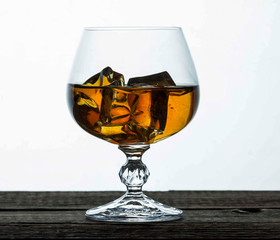 glasses for brandy close-up on an old wooden background