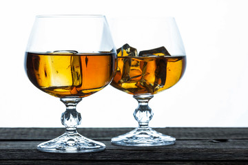 glasses for brandy close-up on an old wooden background