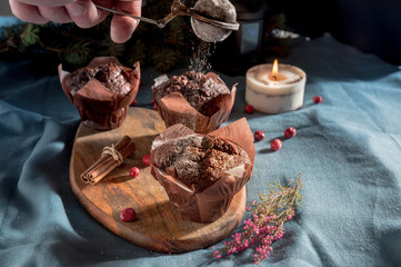 Chocolate muffins on a wooden desk