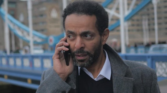 businessman on the phone at Tower Bridge London