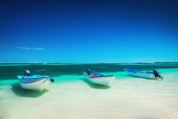 Beautiful caribbean sea and boats, panoramic view from the beach Punta Cana