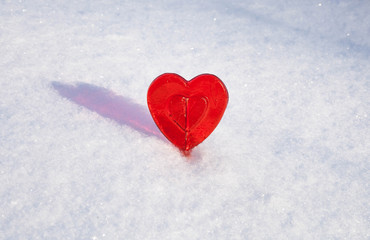 Sweet One Valentines heart made of sugar with reflection effect on snow