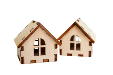 Fototapeta na wymiar Two isolated wooden houses on white background, one house stands behind the other, concept for selling houses, copyspace