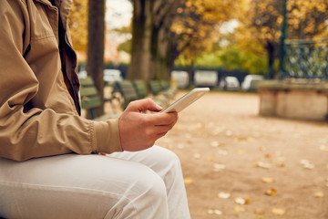 Modern man using cellphone in the European city.