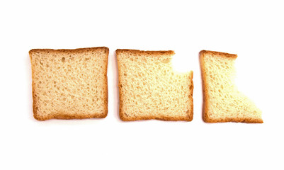 three bites of toast bread on white background