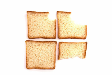 four bites of toast bread on white background