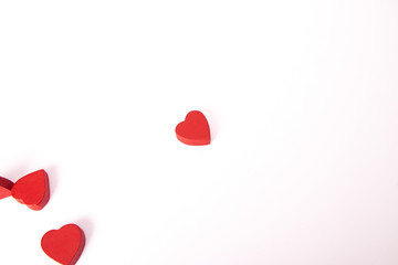 Red wooden hearts on white background. St. Valentine's concept.