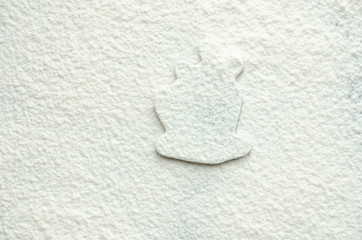 Texture of white flour with a pattern.