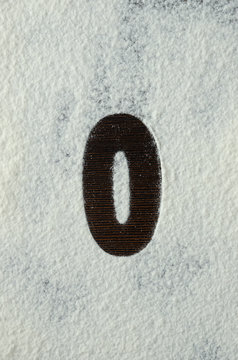 Numbers on white flour. Numbers on white background.