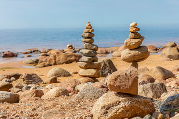 Zen pyramid of stones on seashore.Concept harmony and balance,spa and yoga