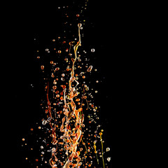 splash of acrylic paint, multicolored paints explosion, abstract background on black