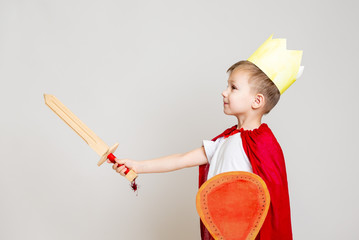 child in knight costume with crown - 246247830