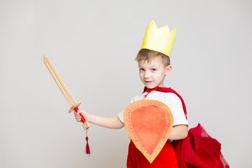 child in knight costume with crown