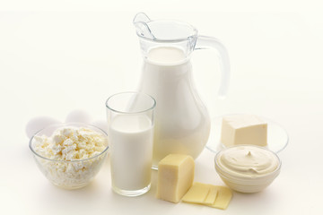 Dairy products on white background. Milk, cottage cheese, sour cream, cheese, butter, eggs, still life from healthy dairy products. Dairy nutrition is good for children's health.