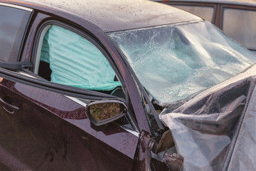 Obraz premium .The broken field of a head-on collision car, with airbags deployed.