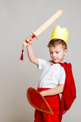 child in knight costume with crown