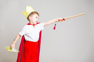 child in knight costume with crown - 246249015