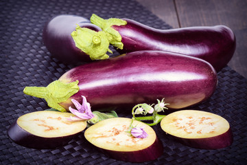 Dietary healthy food. Eggplant on the table. Eggplant. Fresh sliced eggplant. Delicious pieces of eggplant on a beautiful napkin, lying on the table.