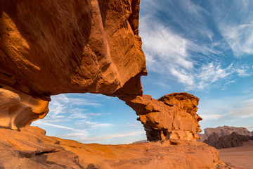 Little bridge rock formation illuminated by sunrise, Wadi Rum desert, Jordan