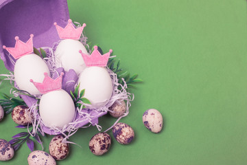 Royal easter eggs in purple carton box. Chicken and Quail Eggs