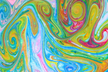 Fluid art from different colors. Multicolored background from paints on liquid. Bright pattern on liquid. Colored paint stains in style of pop art