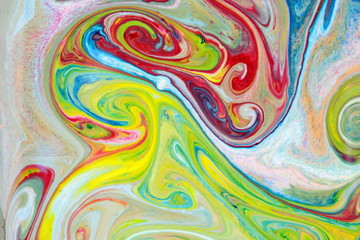 Fluid art from different colors. Multicolored background from paints on liquid. Bright pattern on liquid. Colored paint stains in style of pop art