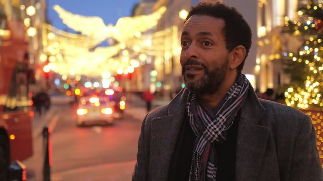 African guy in London on a sightseeing trip