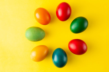 Colorful Easter eggs, easter or spring background with home painted eggs. Top view, copy space. Spring time. Colorful background.