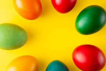 Colorful Easter eggs, easter or spring background with home painted eggs. Top view, copy space. Spring time. Colorful background.