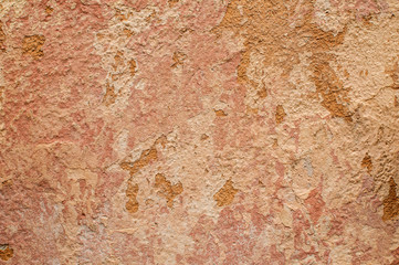 Old grunge weathered cracked plastered wall closeup as background