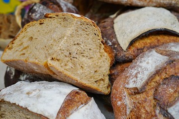 Rustic French sourdough bread boule with slashes on top of the crust
