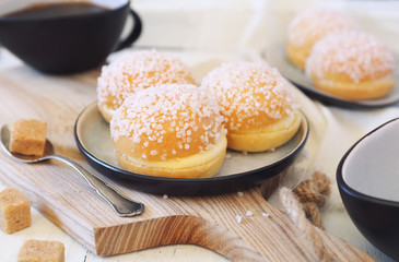 French dessert pastry. Mini tarts tropezienne and cup of coffee
