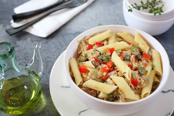 Italian pasta penne with with tuna, bell pepper, olive oil and capers