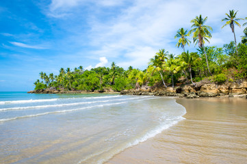 Bright scenic view of a deserted tropical beach on the coast of a remote island in Bahia, Brazil