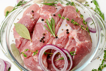  Fresh meat with spices and herbs in a glass pan
