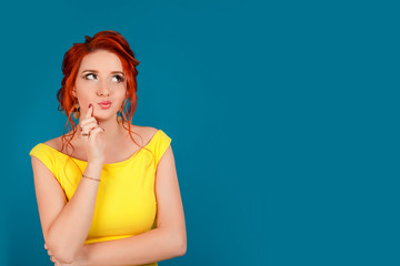 Thinking woman standing pensive contemplating looking skeptic.