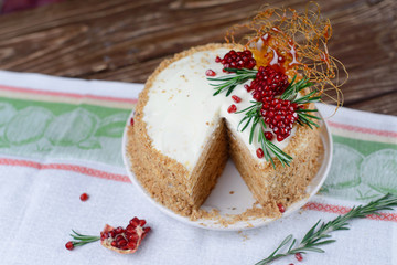 Sponge cake with cream and fresh pomegranate cream