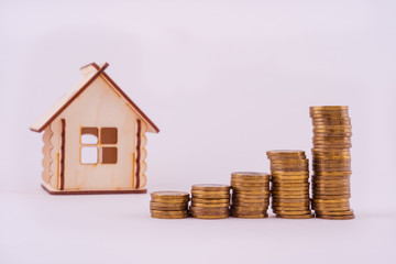 Financial real estate, gold coins and house. Concept: Property investment and house mortgage financial 