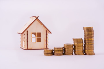 Financial real estate, gold coins and house. Concept: Property investment and house mortgage financial 