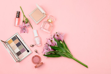 Obraz na płótnie Canvas set of professional decorative cosmetics, makeup tools and accessory isolated on pastel pink background. beauty, fashion and shopping concept. flat lay composition, Perfumery, cosmetics, fragrance